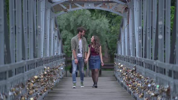 Couple walking on a bridge 