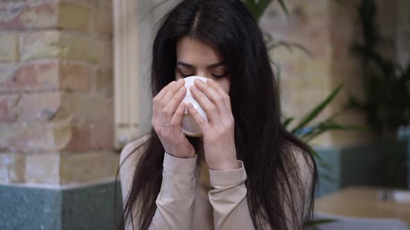 Closeup Middle Eastern Woman Drinking Tasty Tea Looking at Camera Smiling