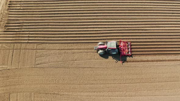 Tractor with Disc Harrows on the Farmland