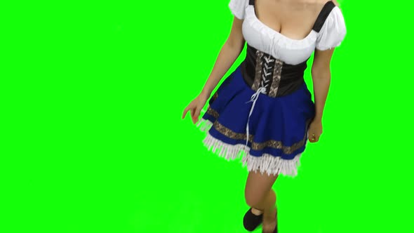 Girl in Bavarian Costume Puts Hands on Hips. Green Screen