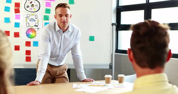 Businessman interacting with coworkers