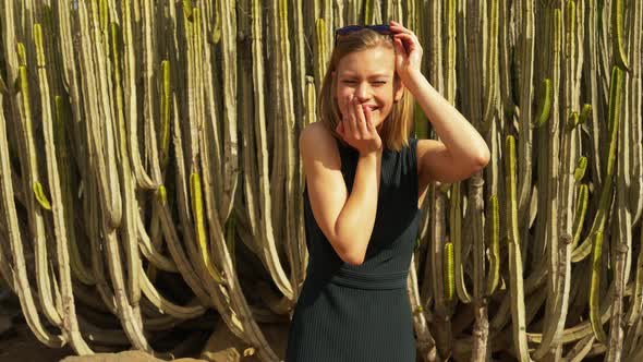 Blonde Female Removing Sunglasses Looking Surprised