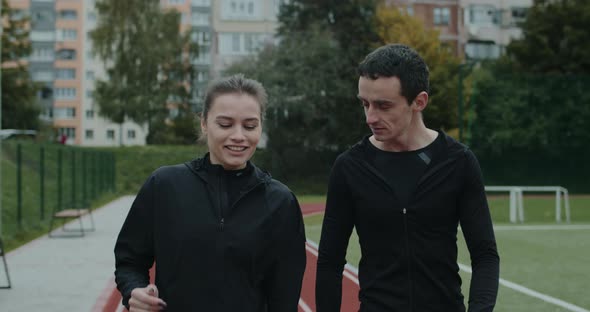 Crop View of Cheerful Woman Smiling and Talking To Man Outdoors