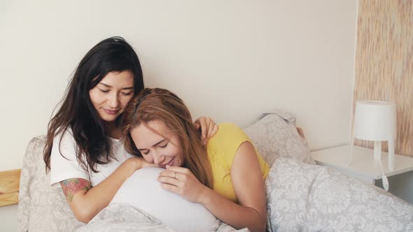 Happy Pregnant Asian Korean Woman with Friend Talking and Laughing While Celebrating Baby Shower at