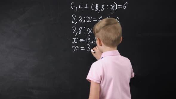 Boy Writing on Chalkboard Math Equation, Solving Exercise, Education Reform