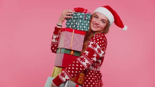 Woman in Christmas Red Sweater Santa Hat Smiling Holding Many Gift Boxes New Year Presents Shopping