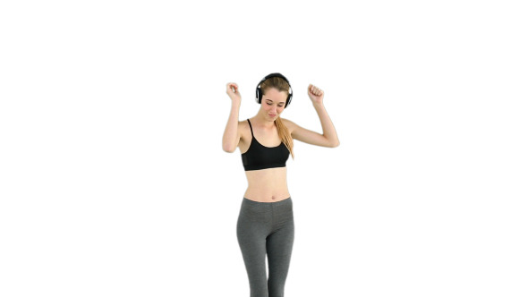 Fit Model Listening To Music And Dancing