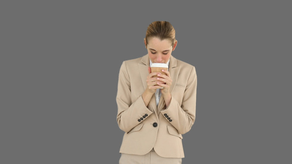 Businesswoman Drinking Coffee To Go 2