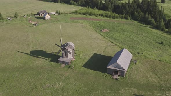 Aerial View of Traditional Antique Wooden Windmill at Russia. Mills Blades Turning By Wind