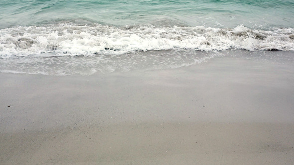 Ocean Rolling In Over The Beach