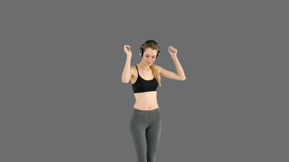 Fit Model Listening To Music And Dancing 2