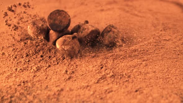 Super Slow Motion Truffles Fall Into the Cocoa