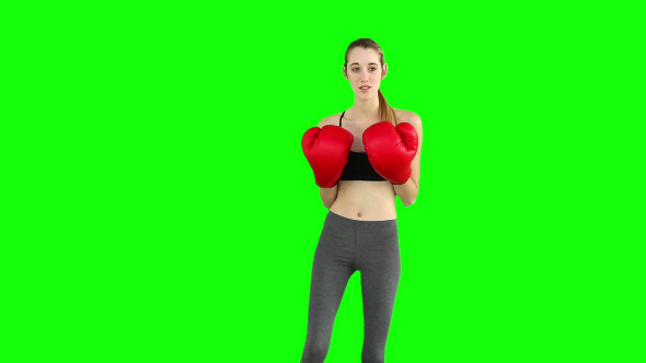 Fit Model Punching With Red Boxing Gloves 1