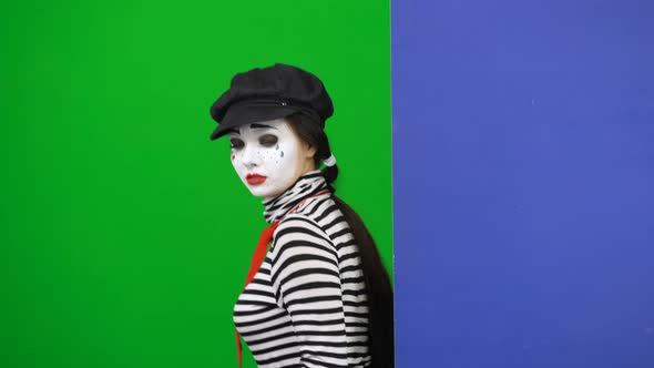 Mime Peeking Out From Behind Board. Chroma Key. Close Up.