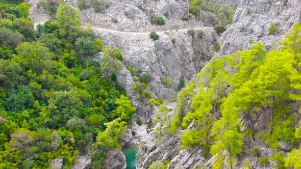 Flying Among Rocky Mountains in a Deep Prehistoric Gorge