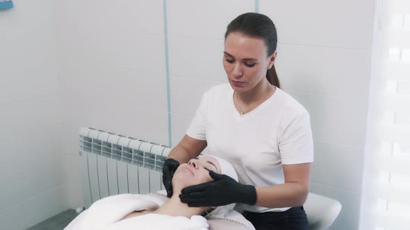 Massaging Skin in Cosmetology Clinic for Young Beautiful Woman