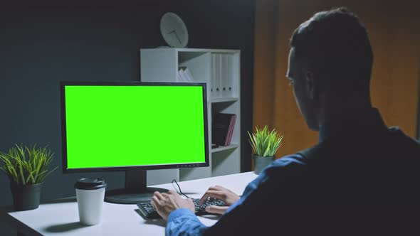 Arab Man Freelancer with Crew Haircut Works on Computer