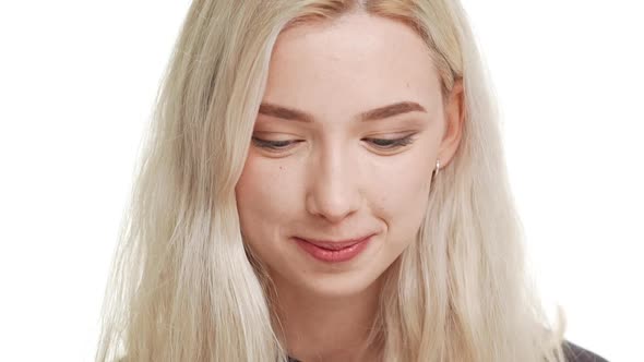 Close Up Footage in Slowmotion of Beautiful Shy Smiling Blonde Caucasian Teenage Girl