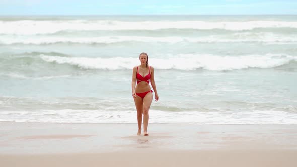 Sexy Woman at the Ocean Walking at the Beach  Extreme Slow Motion Shot