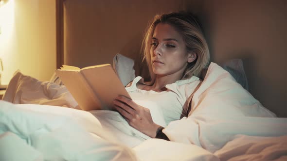 Bed Reading Night Fatigue Sleepy Woman with Book / Videohive