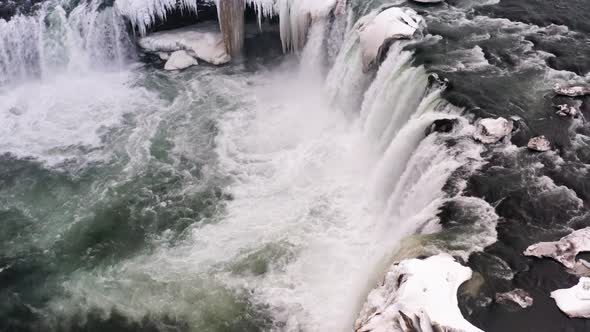 Goðafoss Waterfall and River Skjálfandafljót in North Iceland in Winter, Aerial Close Up View of Col