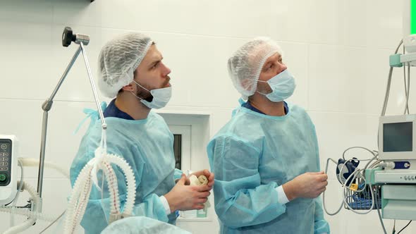 Surgeon Points His Hand on the Monitor