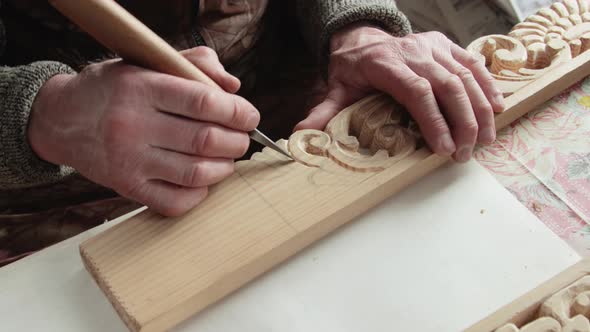 Closeup shoot of a woodcarver at work