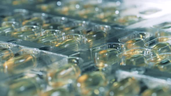 Freshly-produced Pills Are Moving Along Factory Machine