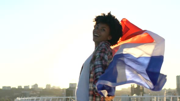 Extremely Happy Woman Holding Flag of France Standing Outdoors, Internationalism