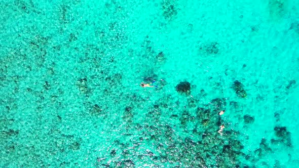 Aerial top view abstract of exotic shore beach time by turquoise lagoon and white sand background of