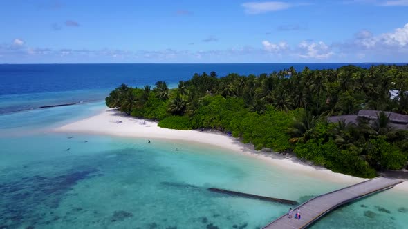 Aerial flying over tourism of luxury seashore beach journey by blue sea and white sand background of