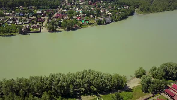 Aerial Flying Back From the Tourist Town Turquoise Mountain River and Forest