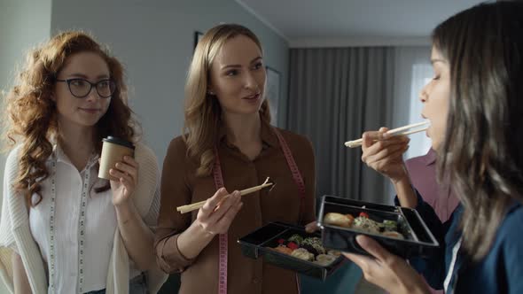 Group of women has brake in tailor's workshop. Shot with RED helium camera in 8K