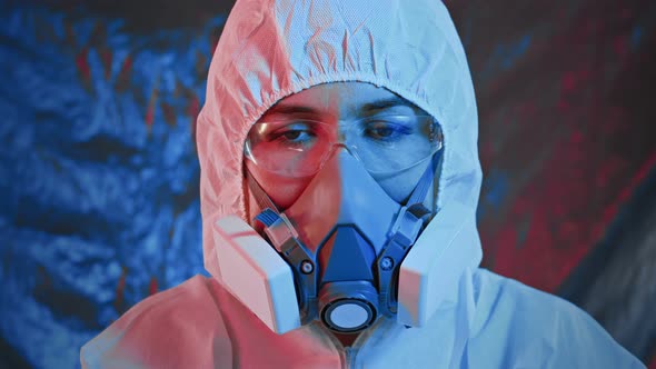 Female Doctor in Protective Suit Glasses and Medical Mask