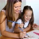 Little Girl Painting with Her Mother at Home - VideoHive Item for Sale