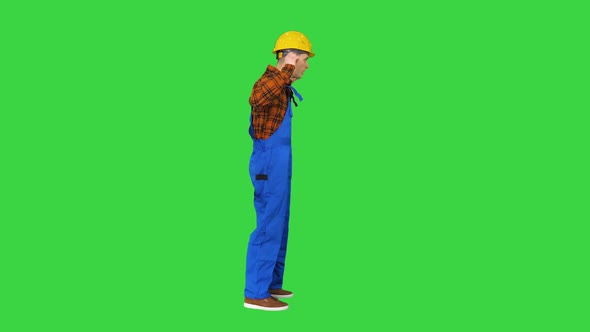 Funky Dancing By Young Construction Worker in Safety Hat on a Green Screen, Chroma Key.