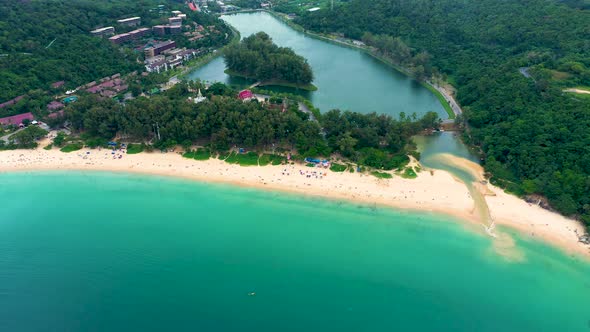 Aerial view of beautiful tropical beach and sea with trees on island for travel and vacation. Nai Ha