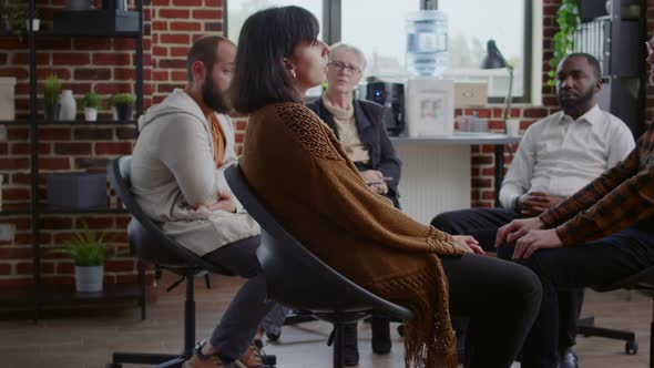 Woman Sharing Sad Story with People and Psychologist at Aa Group Therapy Session