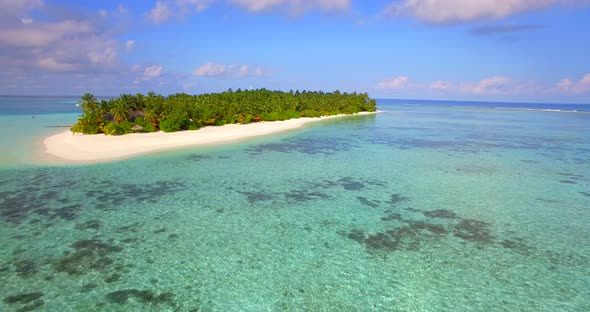 Aerial drone view of a scenic tropical island in the Maldives