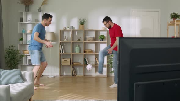 Young Men Playing Football