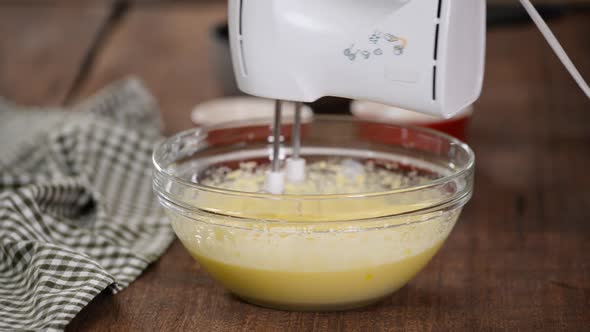 Beat the Eggs with a Mixer in Glass Bowl