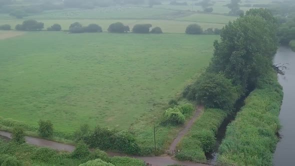 Aerial view of the River Otter in Devon South England. Farm land and a walking path is clearly visib