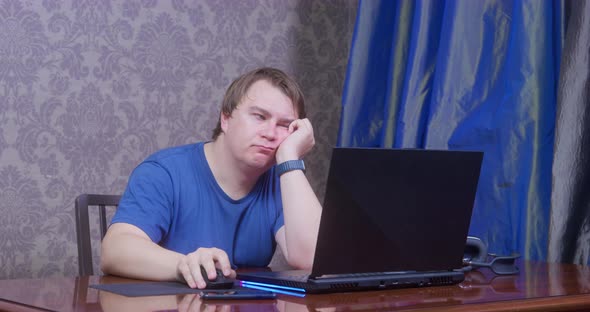 Plump Man Freelancer Gets Tired Working on Computer at Home