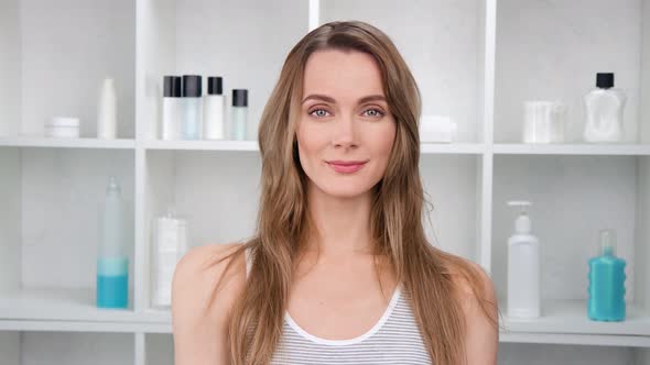 Adorable Happy Lady with Perfect Moisturizing Facial Smile at Spa Salon Light Background  Footage