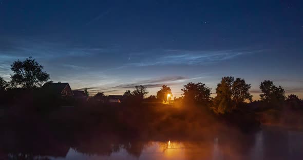 Comet C 2020 F3 NEOWISE in the Night Sky with Silvery Clouds, a Beautiful Night Time Lapse