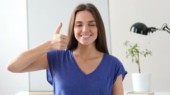 Beautiful Young Woman Gesturing Thumbs Up