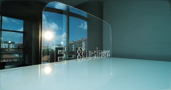 Glass E-business Letters and Office in Background