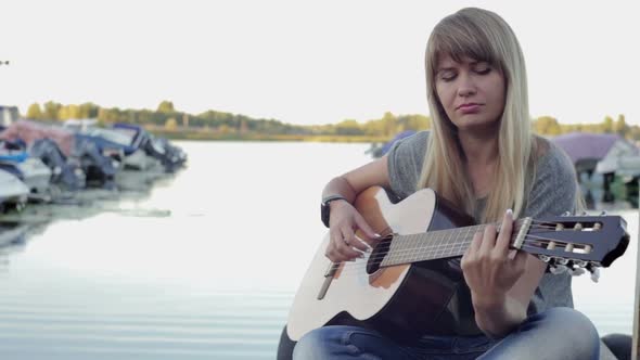 Girl Playing on the Guitar