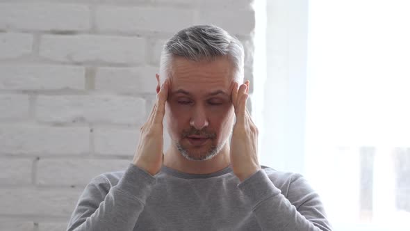 Headache, Frustrated Working Middle Aged Man in Office