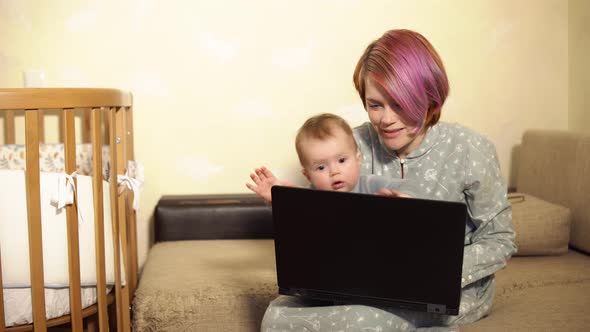 Small Child Closes His Mother's Work Laptop and Demands Focussed on Himself